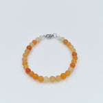 Perlenarmband orange mix